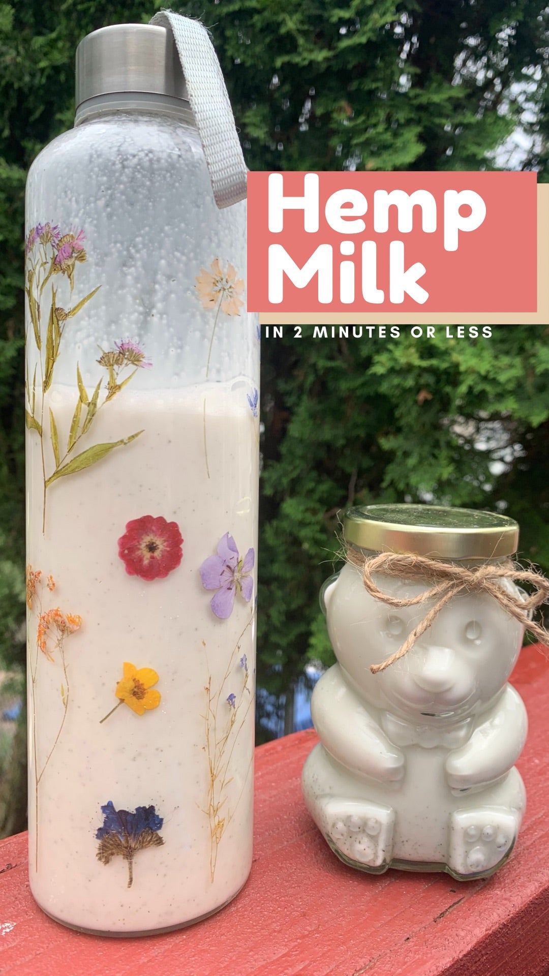 two clear glass jars filled with homemade hempseed milk outside with nature in background